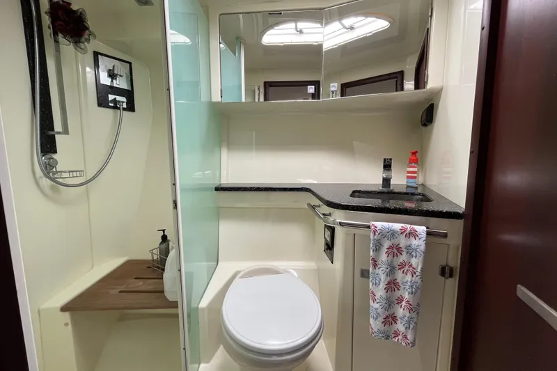 Slide: The Image of Luxurious bathroom in 2015 Monterey 415 Sport Yacht with modern fixtures and elegant design. - 25