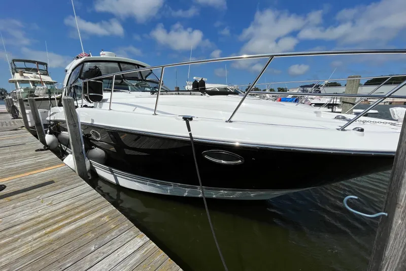 Slide: The Image of 2015 Monterey 415 Sport Yacht docked at marina under blue sky. - 3