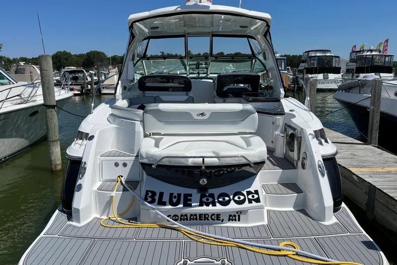 Slide: The Image of 2015 Monterey 415 Sport Yacht docked at marina, rear view with seating and deck. - 5