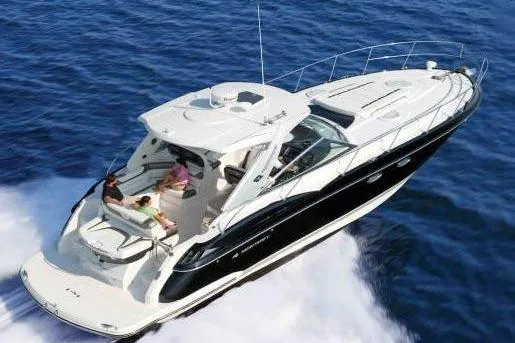 Slide: The Image of 2015 Monterey 415 Sport Yacht cruising on open water, aerial view. - 6