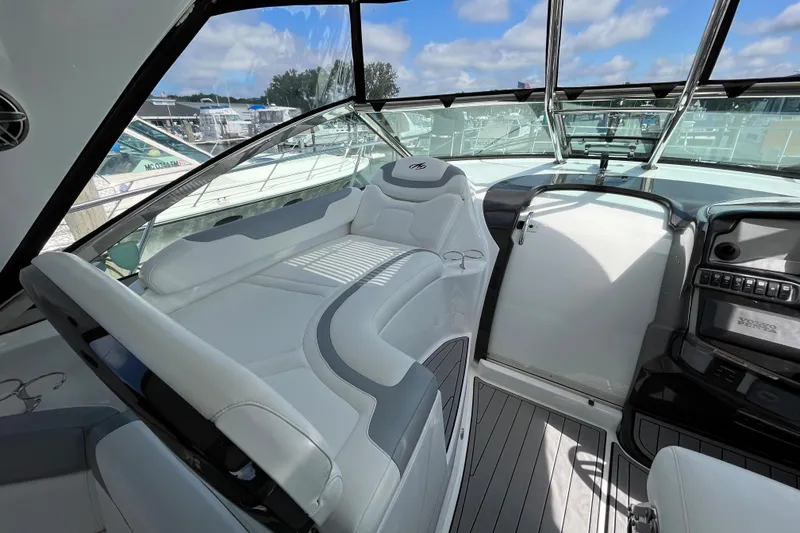 Slide: The Image of 2015 Monterey 415 Sport Yacht cockpit with luxurious seating and modern dashboard. - 9