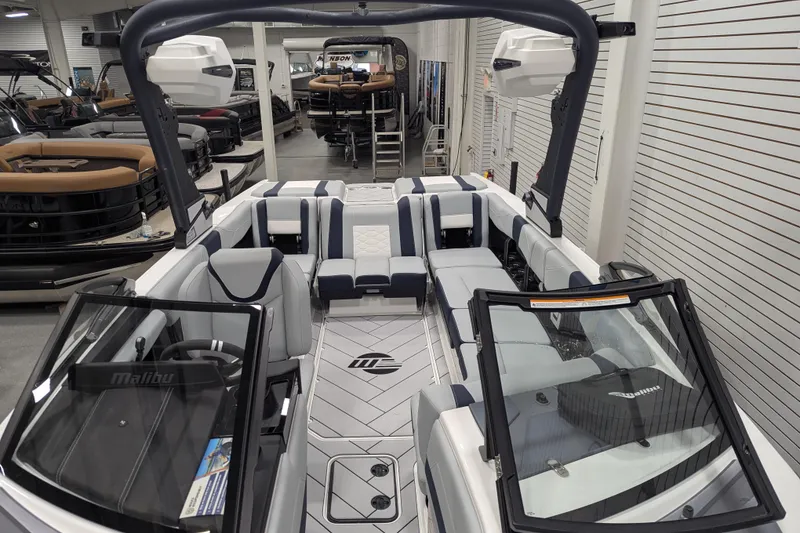 Slide: The Image of 2026 Malibu Wakesetter 23 LSV boat interior, featuring sleek seating and modern design. - 19
