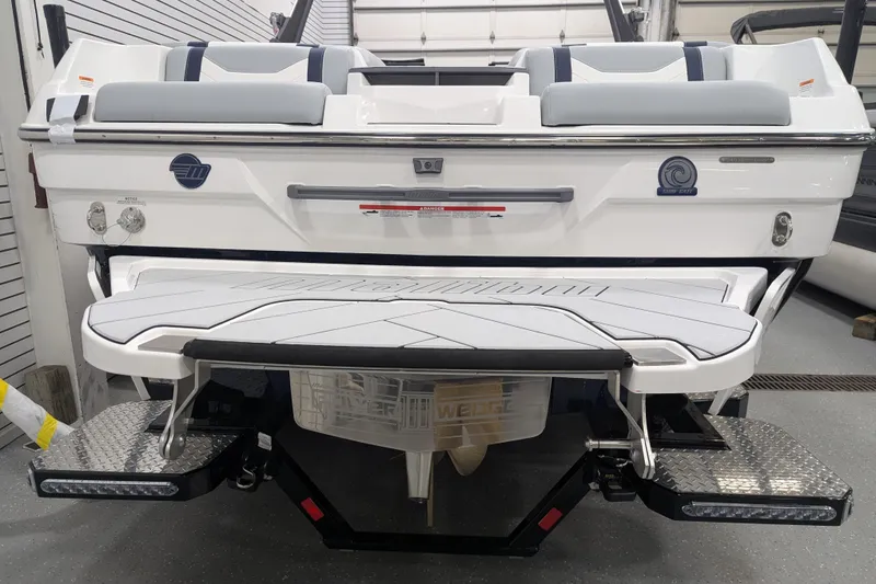 Slide: The Image of 2026 Malibu Wakesetter 23 LSV boat rear view with swim platform and seating. - 8