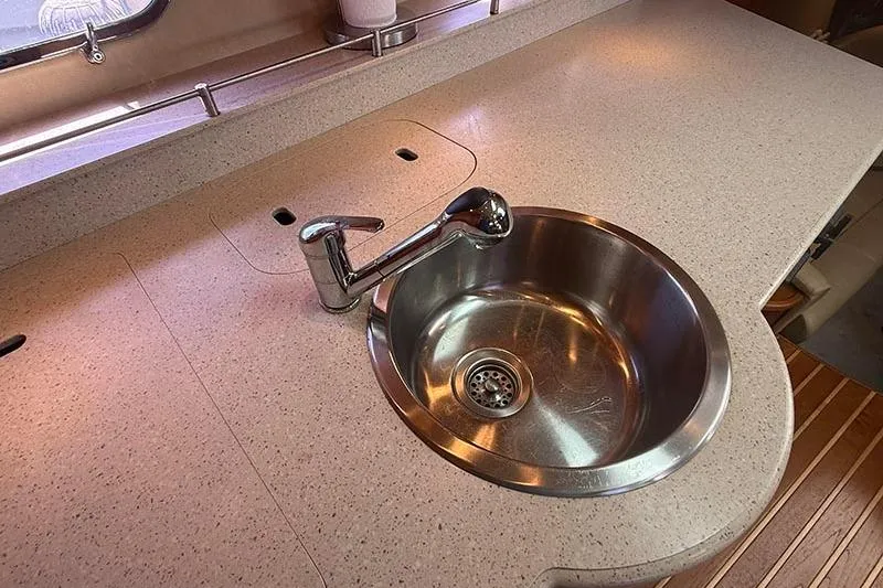 Slide: The Image of 2008 Tiara Yachts 3900 Sovran kitchen sink with modern faucet and countertop. - 10