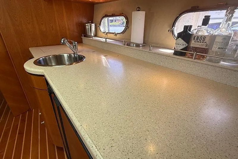 Slide: The Image of Luxurious 2008 Tiara Yachts 3900 Sovran galley with sleek countertop and modern fixtures. - 11