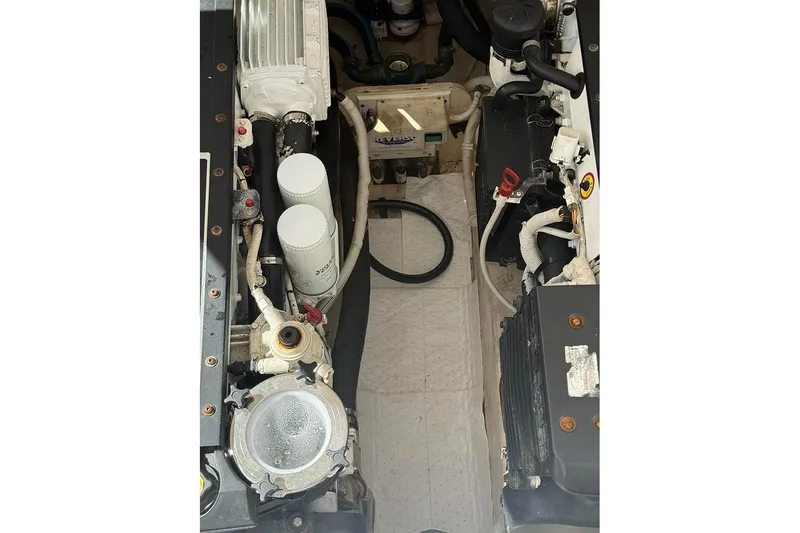 Slide: The Image of Engine compartment of 2008 Tiara Yachts 3900 Sovran, showcasing mechanical components and filters. - 27