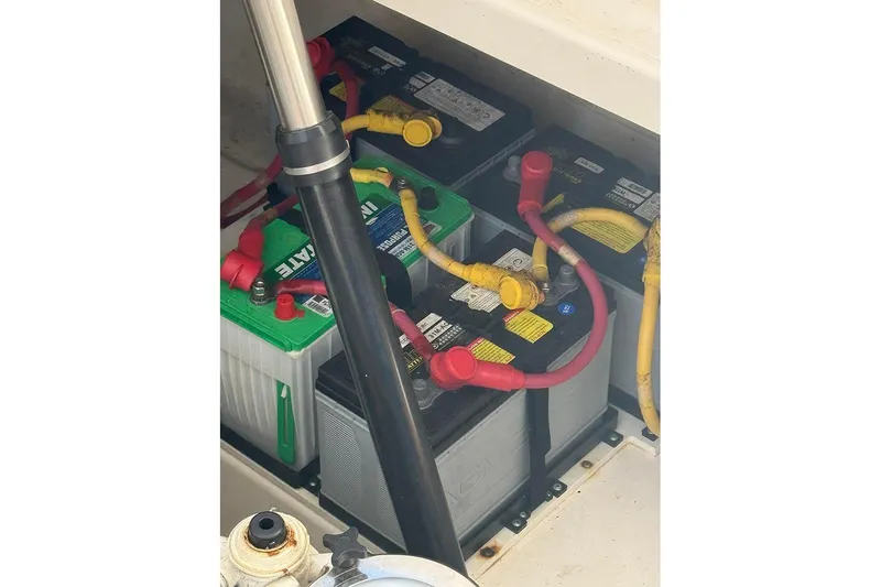 Slide: The Image of Battery compartment of a 2008 Tiara Yachts 3900 Sovran with connected cables. - 28