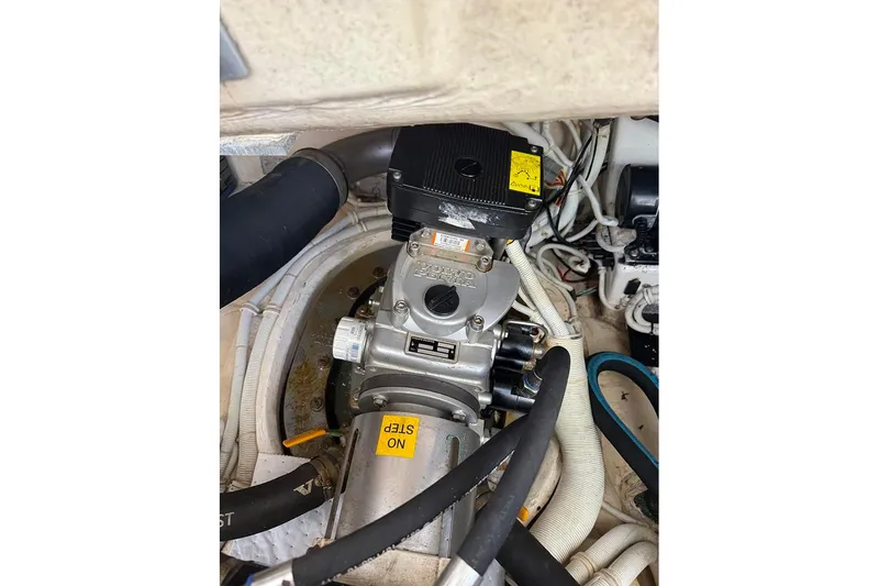 Slide: The Image of Engine compartment of 2008 Tiara Yachts 3900 Sovran, showcasing mechanical components and wiring. - 34