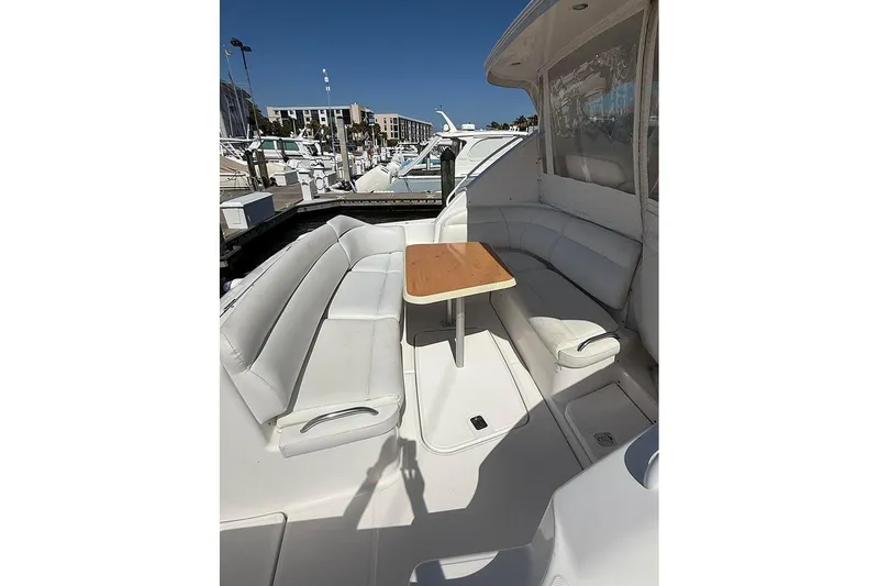 Slide: The Image of 2008 Tiara Yachts 3900 Sovran interior with white seating and wooden table. - 38