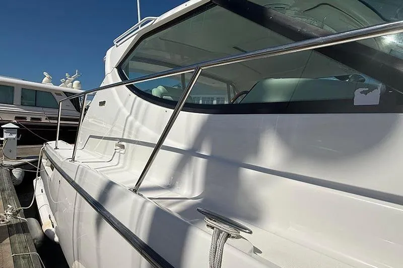 Slide: The Image of 2008 Tiara Yachts 3900 Sovran docked, showcasing sleek white exterior and modern design. - 4