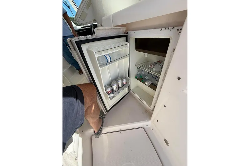 Slide: The Image of Open mini fridge on 2008 Tiara Yachts 3900 Sovran, stocked with beverages. - 55