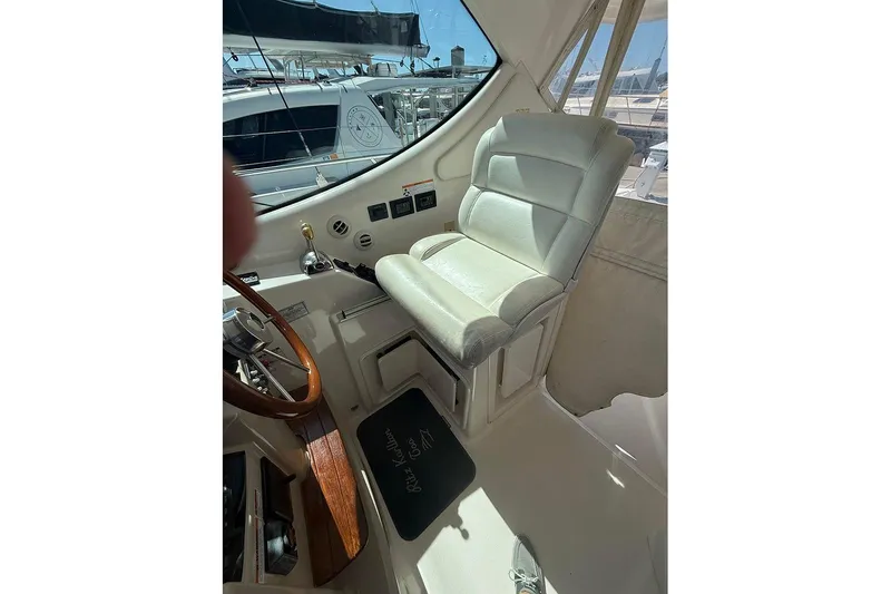 Slide: The Image of 2008 Tiara Yachts 3900 Sovran helm with leather seat and wooden steering wheel. - 69