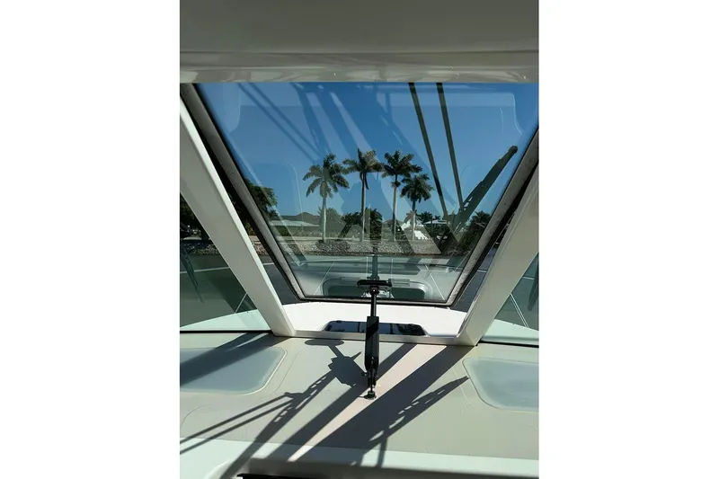 Slide: The Image of View from 2008 Tiara Yachts 3900 Sovran cockpit, showcasing palm trees through the windshield. - 75