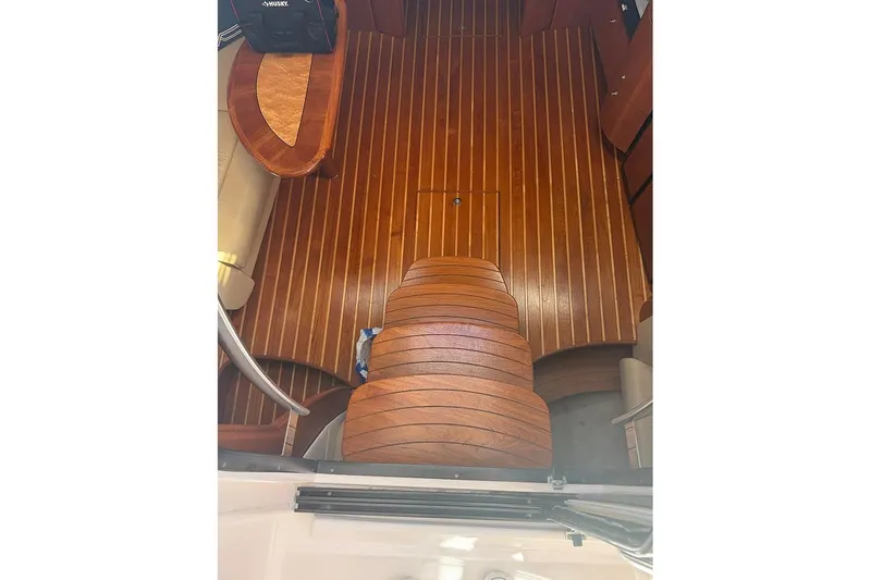 Slide: The Image of 2008 Tiara Yachts 3900 Sovran interior with polished wooden flooring and seating area. - 76