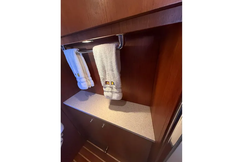 Slide: The Image of 2008 Tiara Yachts 3900 Sovran interior with wooden cabinetry and towel rack. - 82