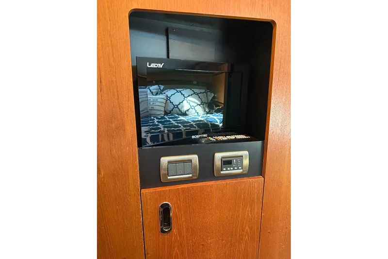 Slide: The Image of LED TV and control panel in 2008 Tiara Yachts 3900 Sovran interior. - 84