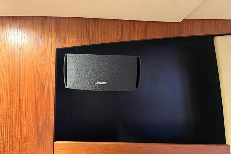 Slide: The Image of Bose speaker on 2008 Tiara Yachts 3900 Sovran's wooden interior panel. - 88