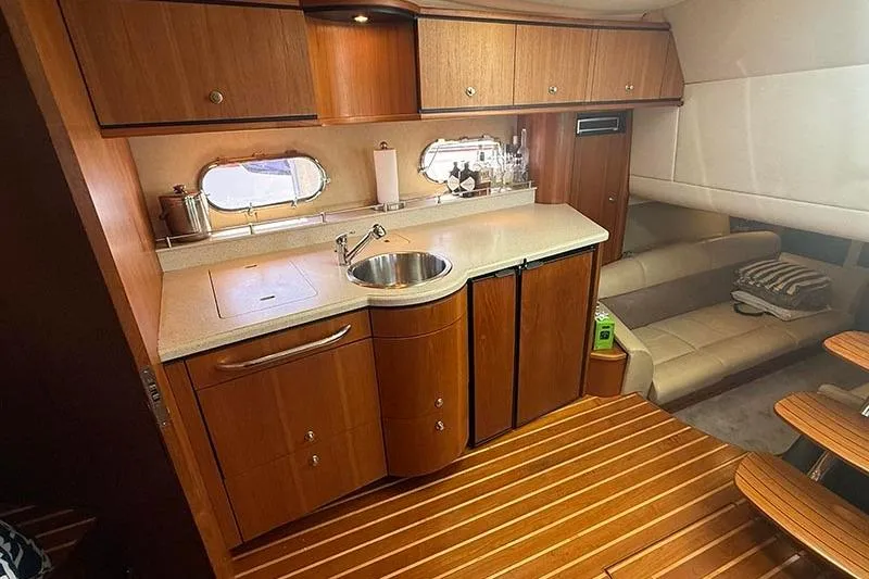 Slide: The Image of Luxurious 2008 Tiara Yachts 3900 Sovran interior with elegant wood cabinetry and cozy seating. - 90