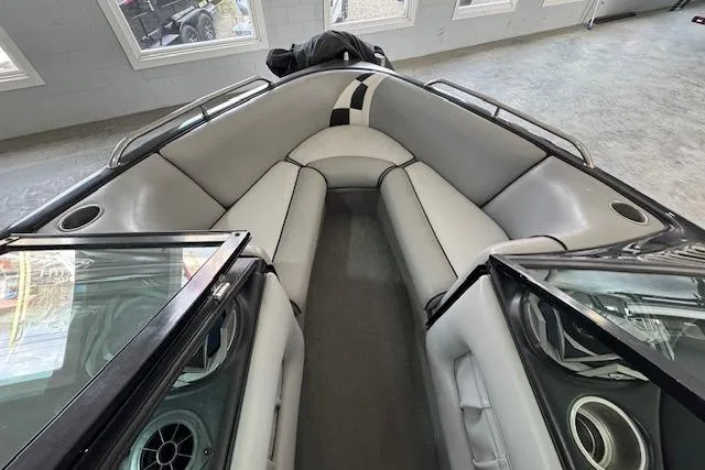 Slide: The Image of 2007 Calabria CAL AIR PRO V boat interior with gray seating and cup holders. - 10