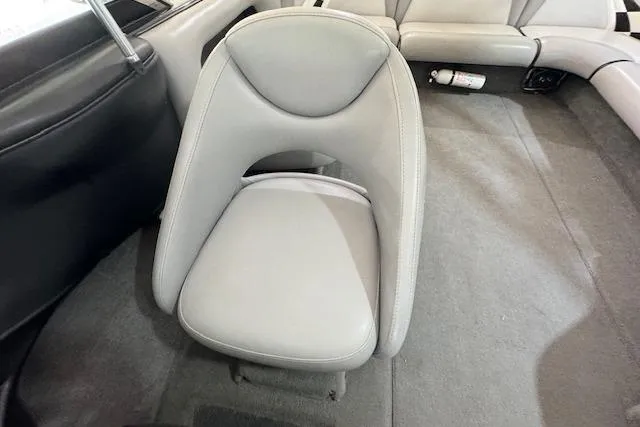 Slide: The Image of 2007 Calabria CAL AIR PRO V boat interior with gray seating and carpet. - 8