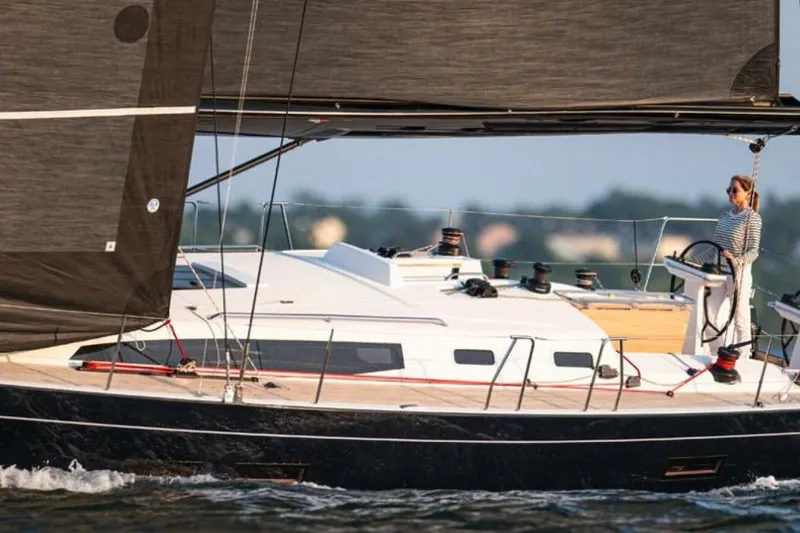 The Image of 2026 J Boats J/45 sailing yacht with person at the helm on open water. - 1