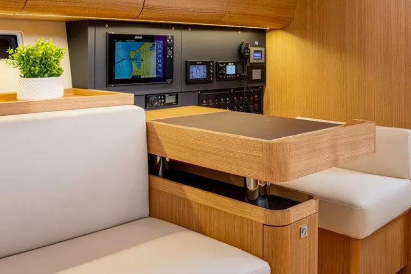 Slide: The Image of Interior of 2026 J Boats J/45 yacht with navigation equipment and seating area. - 5