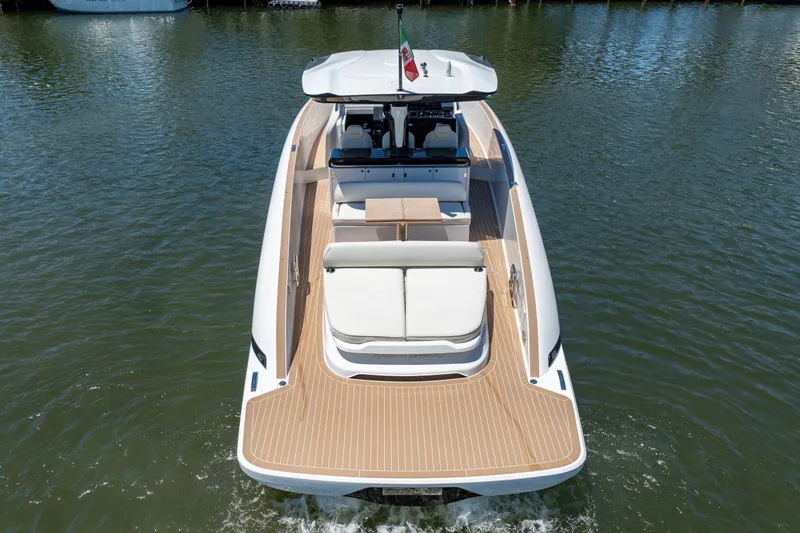Slide: The Image of 2027 Solaris Power 40 Open yacht on water, rear view, elegant design. - 11