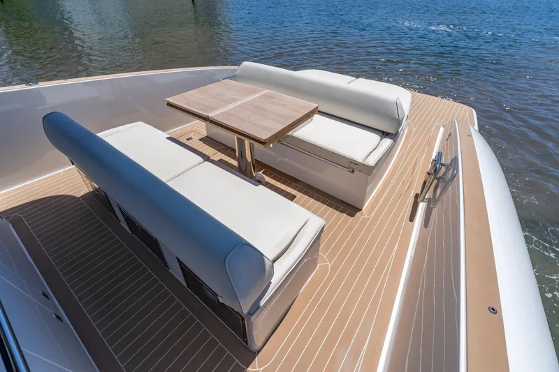 Slide: The Image of Luxurious seating area on 2027 Solaris Power 40 Open yacht, featuring elegant wooden deck. - 12