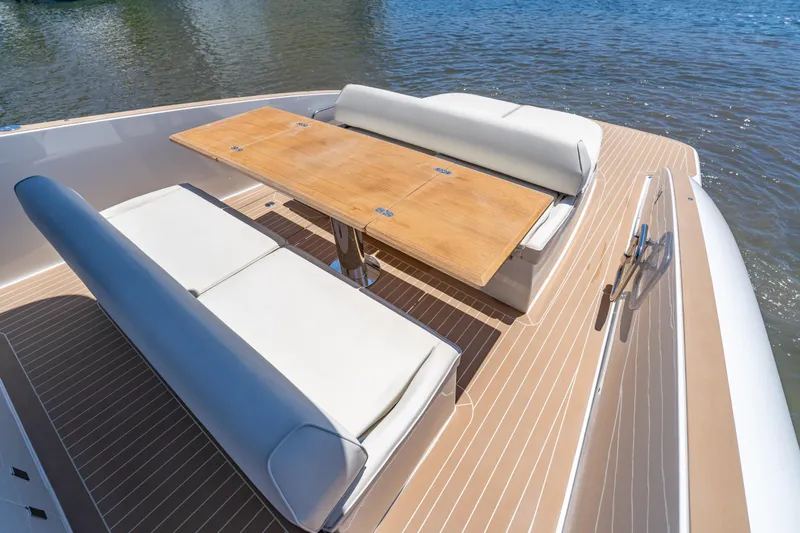 Slide: The Image of Luxurious seating area on 2027 Solaris Power 40 Open yacht with wooden table. - 13