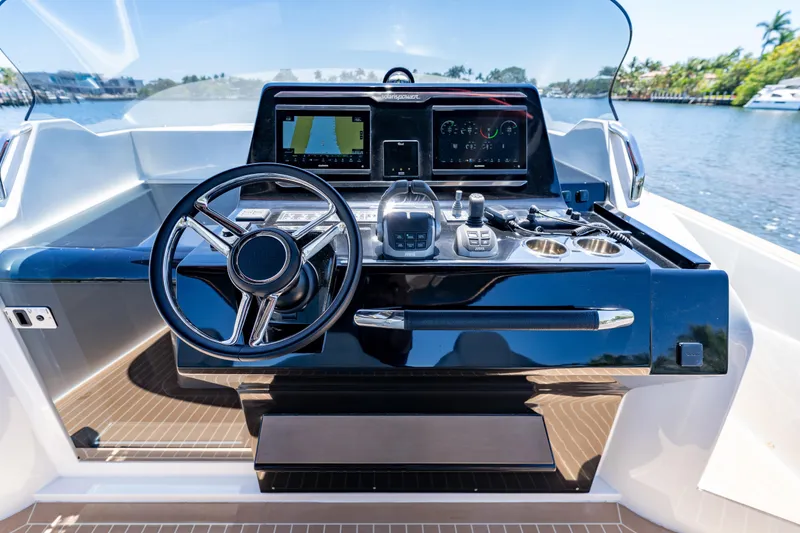 Slide: The Image of Helm of 2027 Solaris Power 40 Open yacht with modern navigation controls. - 18