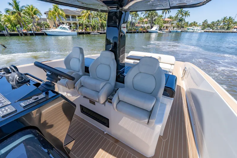 Slide: The Image of 2027 Solaris Power 40 Open yacht interior with luxurious seating and modern controls. - 27