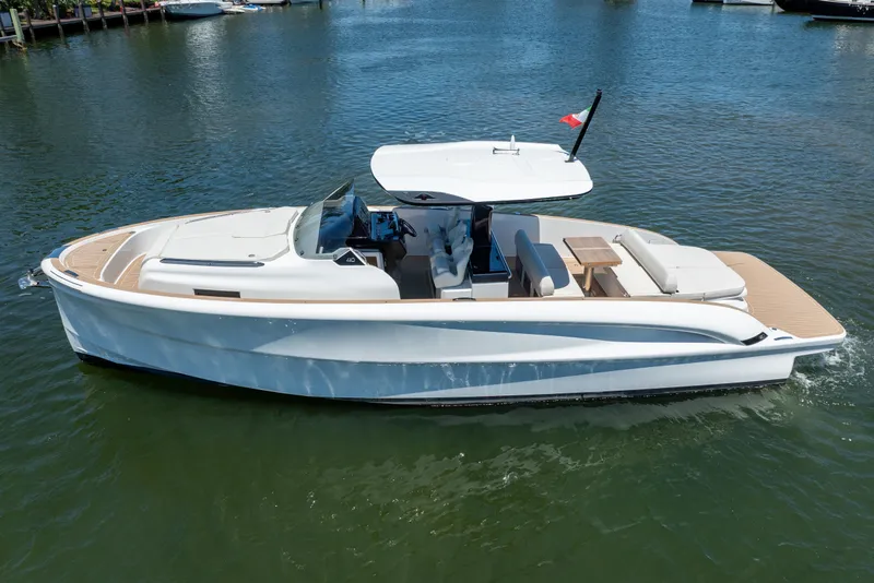 Slide: The Image of 2027 Solaris Power 40 Open yacht cruising on calm water, featuring sleek design and spacious deck. - 3