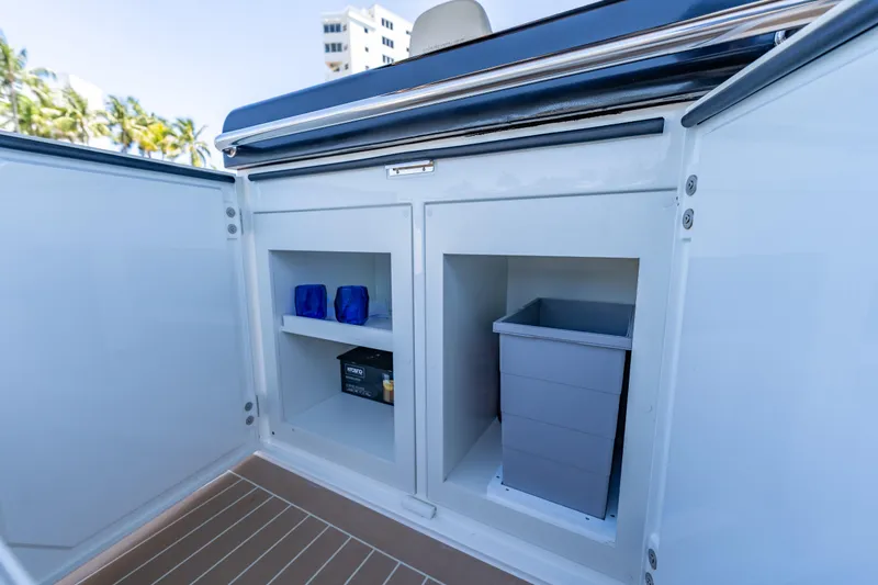 Slide: The Image of Open storage compartment on Solaris Power 40 Open yacht, featuring shelves and a waste bin. - 35