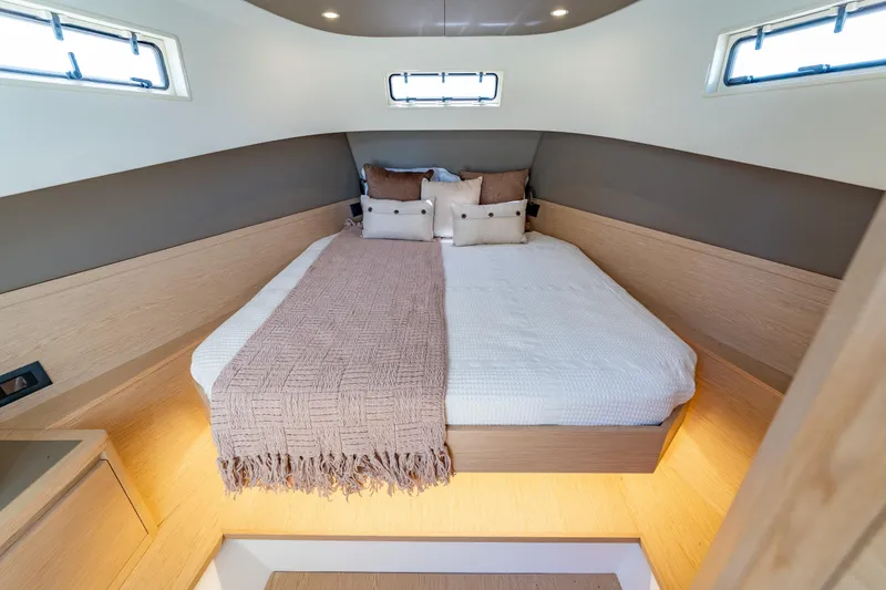 Slide: The Image of Luxurious interior cabin of 2027 Solaris Power 40 Open yacht, featuring a cozy bed. - 37