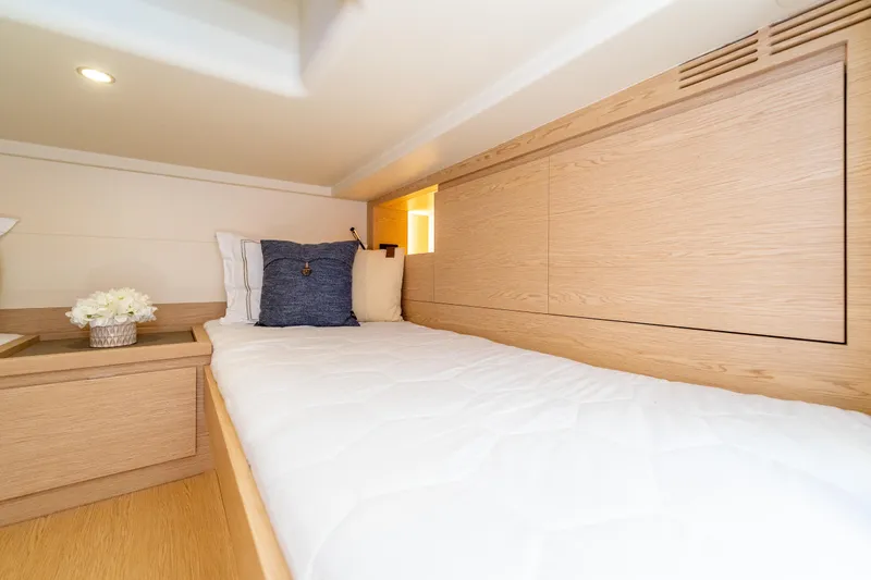 Slide: The Image of Luxurious cabin interior of 2027 Solaris Power 40 Open yacht with cozy bedding. - 46