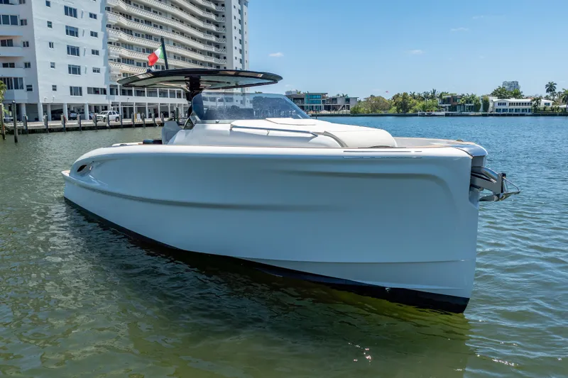 Slide: The Image of 2027 Solaris Power 40 Open yacht docked near waterfront buildings. - 7