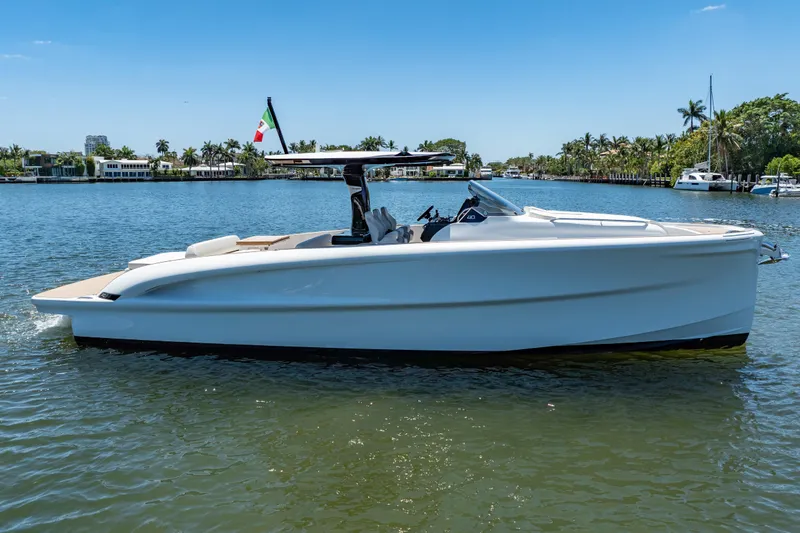 Slide: The Image of 2027 Solaris Power 40 Open yacht cruising on a sunny day in a scenic waterway. - 9