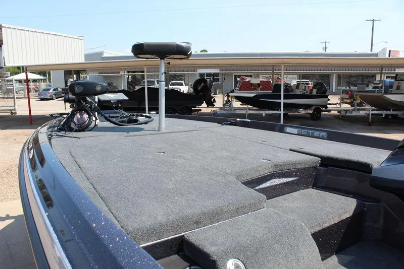 Slide: The Image of 2026 Skeeter ZXE21 boat interior with steering wheel and control panel. - 15