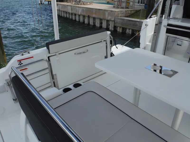 Slide: The Image of 2023 Jeanneau Leader 10.5 WA Series 2 boat interior with seating and table. - 16