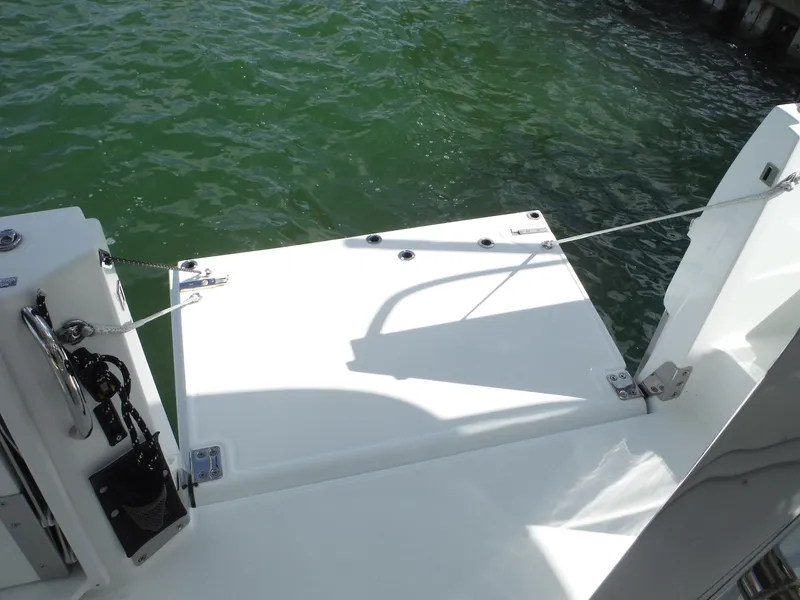 Slide: The Image of 2023 Jeanneau Leader 10.5 WA Series 2 swim platform on calm water. - 23