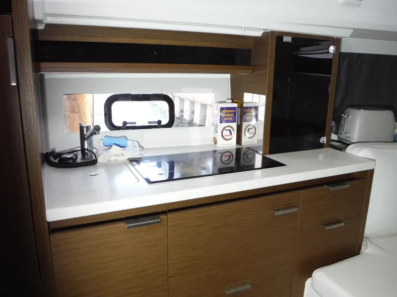 Slide: The Image of 2023 Jeanneau Leader 10.5 WA Series 2 yacht interior kitchen with modern amenities. - 32