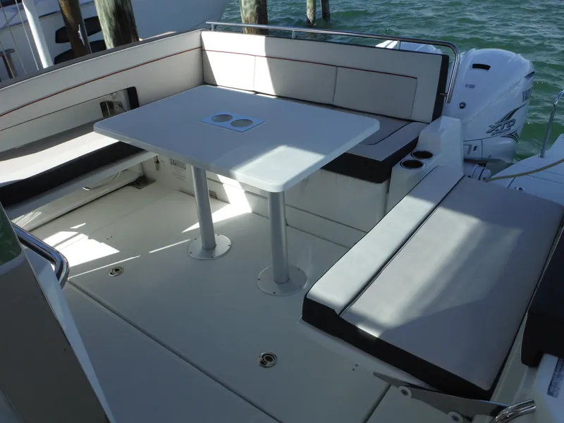 Slide: The Image of 2023 Jeanneau Leader 10.5 WA Series 2 boat interior with seating and table. - 41