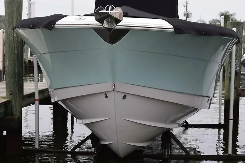 Slide: The Image of 2018 Robalo R302 Center Console boat docked, front view. - 3