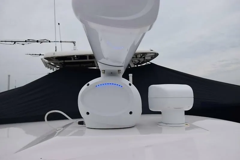 Slide: The Image of 2018 Robalo R302 Center Console boat with radar equipment on deck. - 32