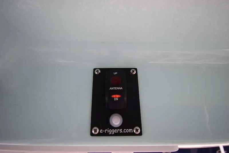 Slide: The Image of Control panel on a 2018 Robalo R302 Center Console boat, featuring antenna switch. - 33