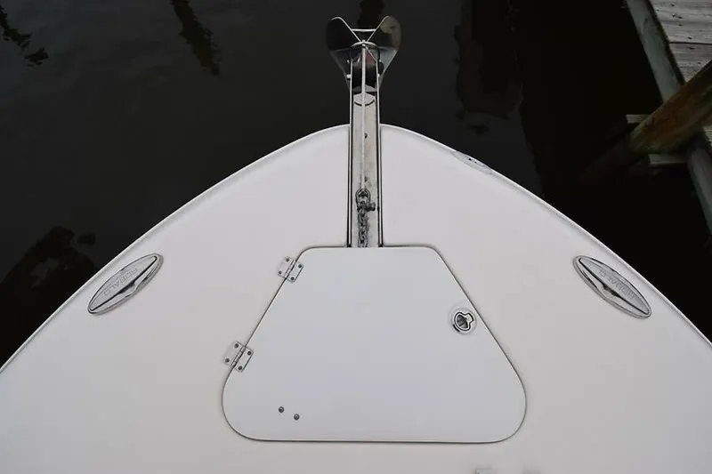 Slide: The Image of Bow of 2018 Robalo R302 Center Console boat with anchor and hatch. - 5