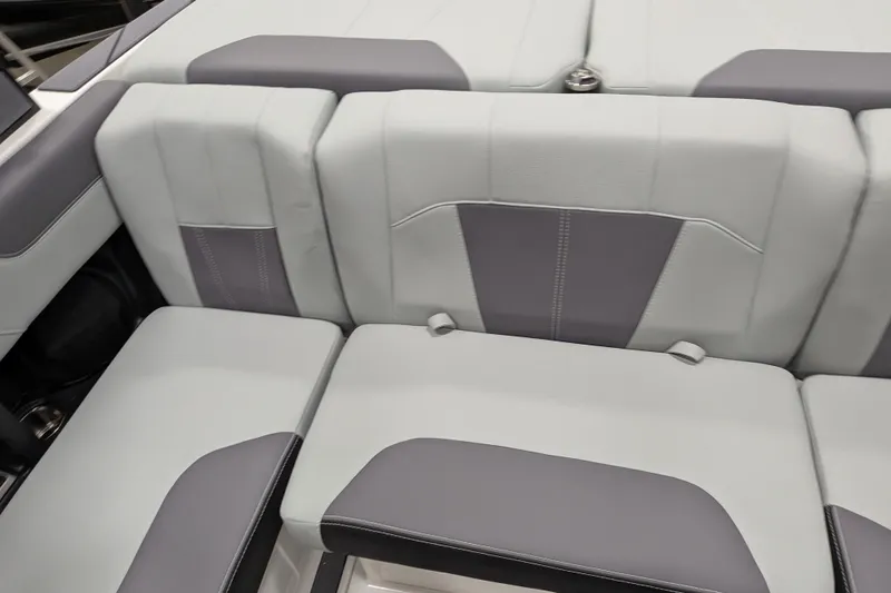 Slide: The Image of 2026 Malibu Wakesetter 20 VTX interior seating, featuring gray and white upholstery. - 11