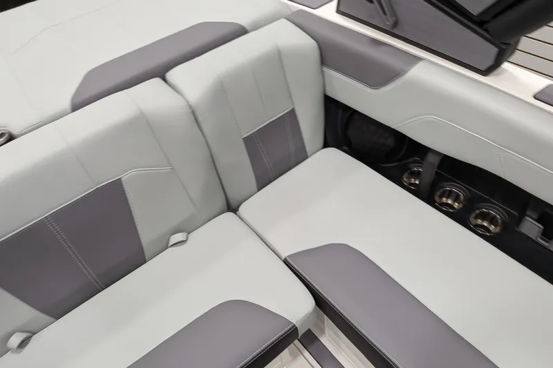 Slide: The Image of 2026 Malibu Wakesetter 20 VTX interior seating with sleek, modern design and cup holders. - 12
