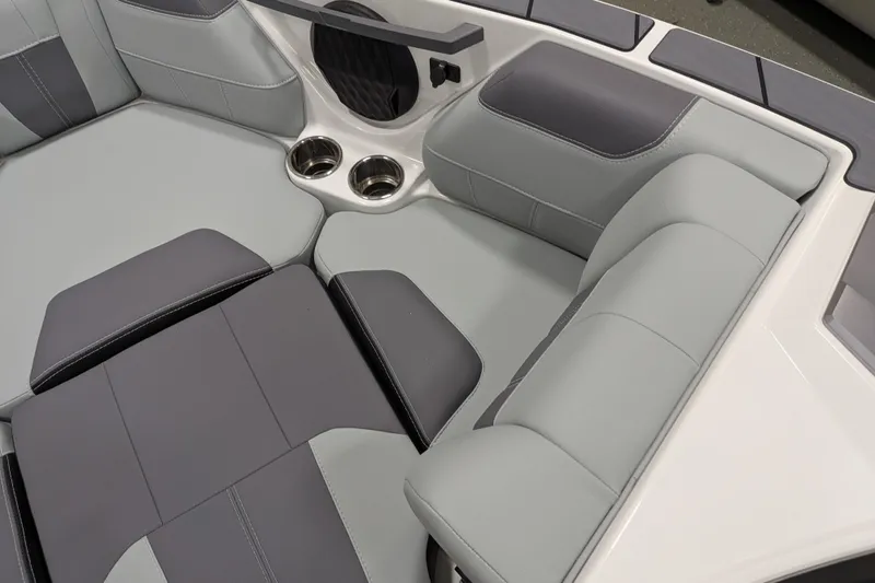 Slide: The Image of 2026 Malibu Wakesetter 20 VTX interior seating with cup holders and sleek design. - 17