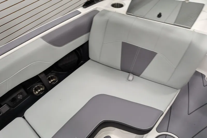 Slide: The Image of 2026 Malibu Wakesetter 20 VTX interior seating with sleek gray upholstery design. - 18
